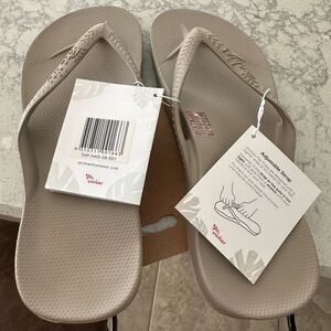 Archie’s Brand New Flip Flops. Tags are attached. Size 9. Taupe Color